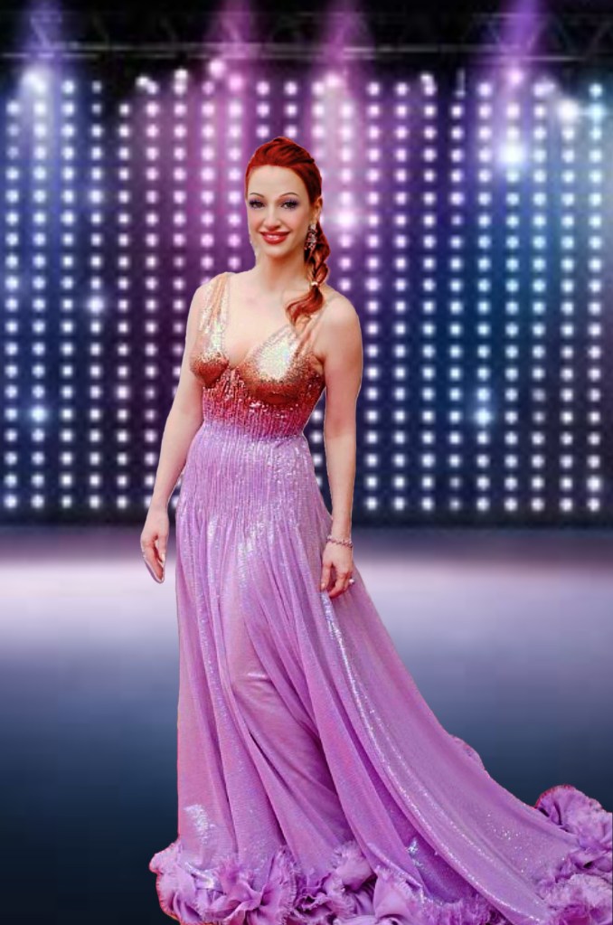 A woman wearing a sparkling pink gown stands confidently on stage against a backdrop of colorful lights.